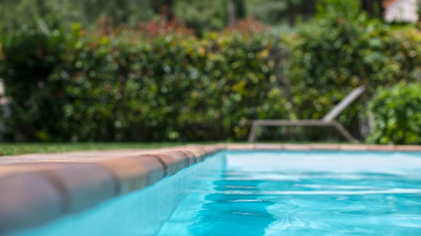 Example of swimming pool surrounds work by Holmes Landscapes